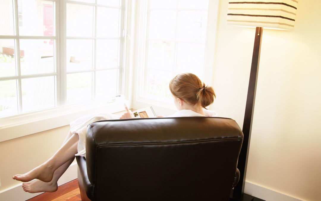 Lady reading by window